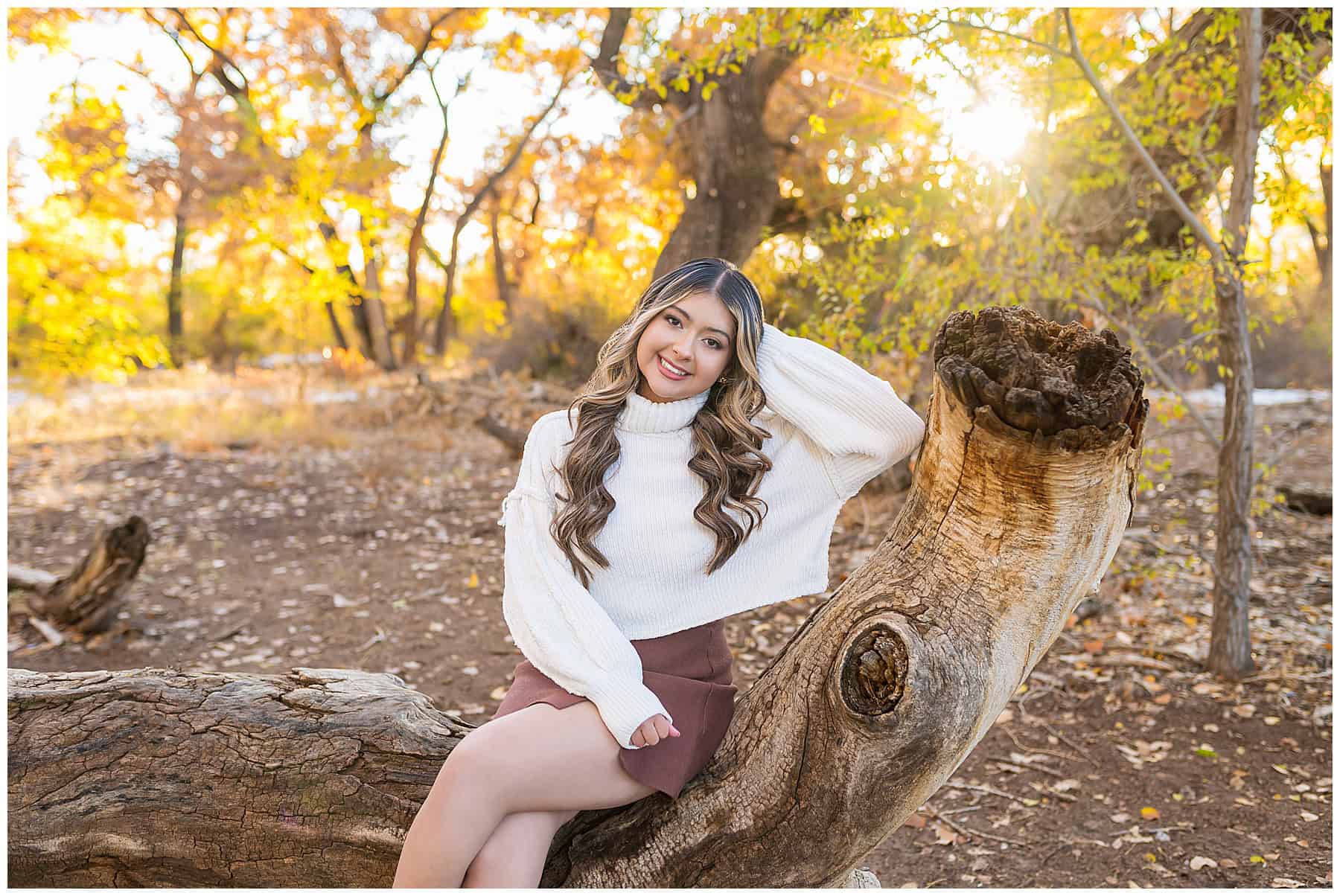 Girl wearing a cute fall outfit for Senior Pictures in Rio Rancho New Mexico. 