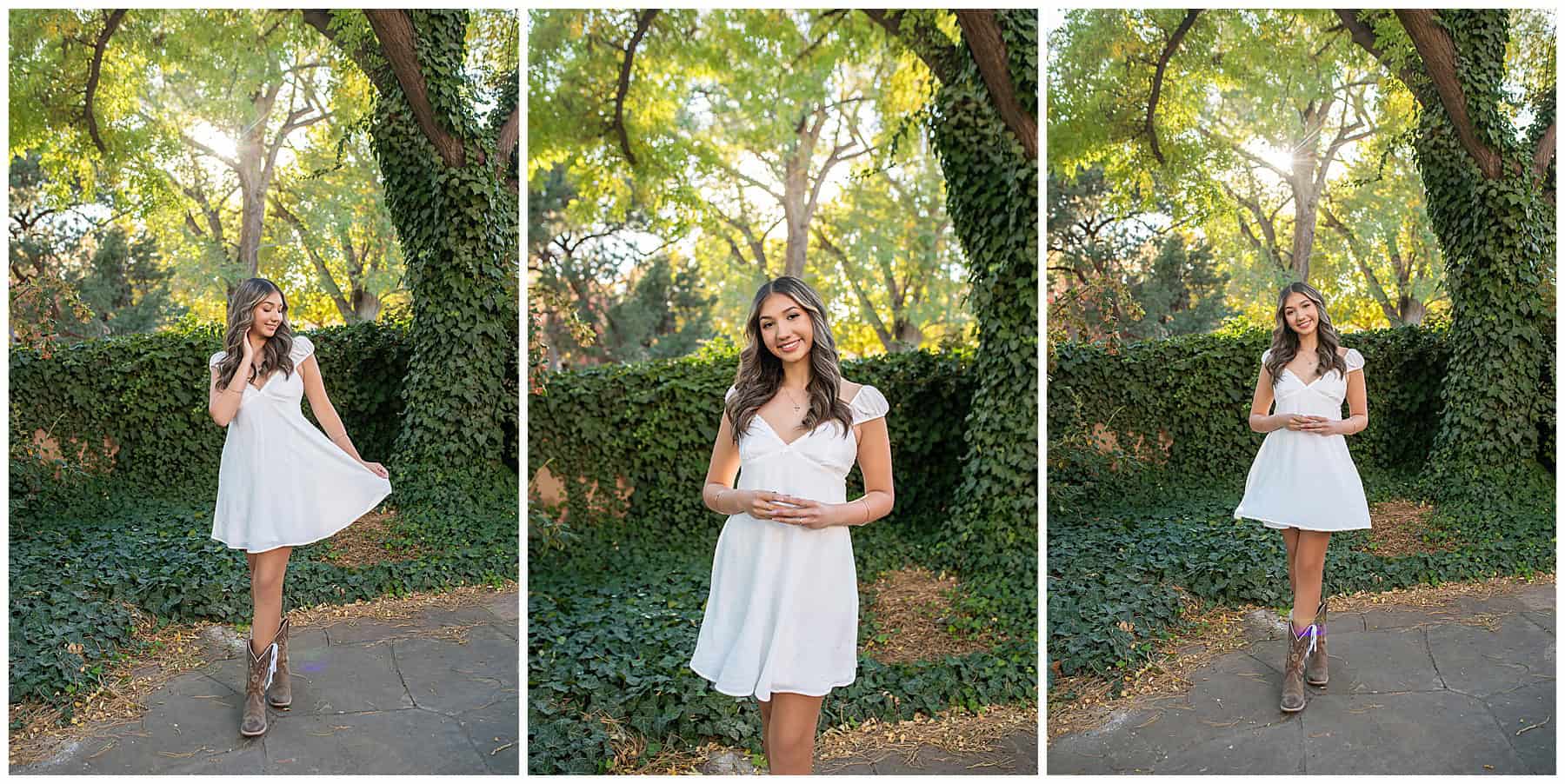 Senior Portraits of a girl in a white dress. with Beautiful green vines at her session with Anchored memory photography. 