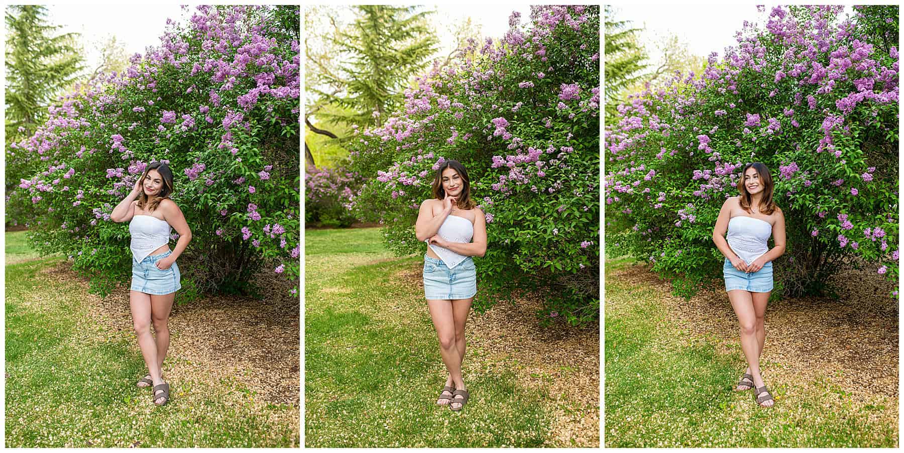 High school senior girl in a jean skirt and white top standing in front of blooming lilac bushes during her senior photo session in Albuquerque at the University of New Mexico.