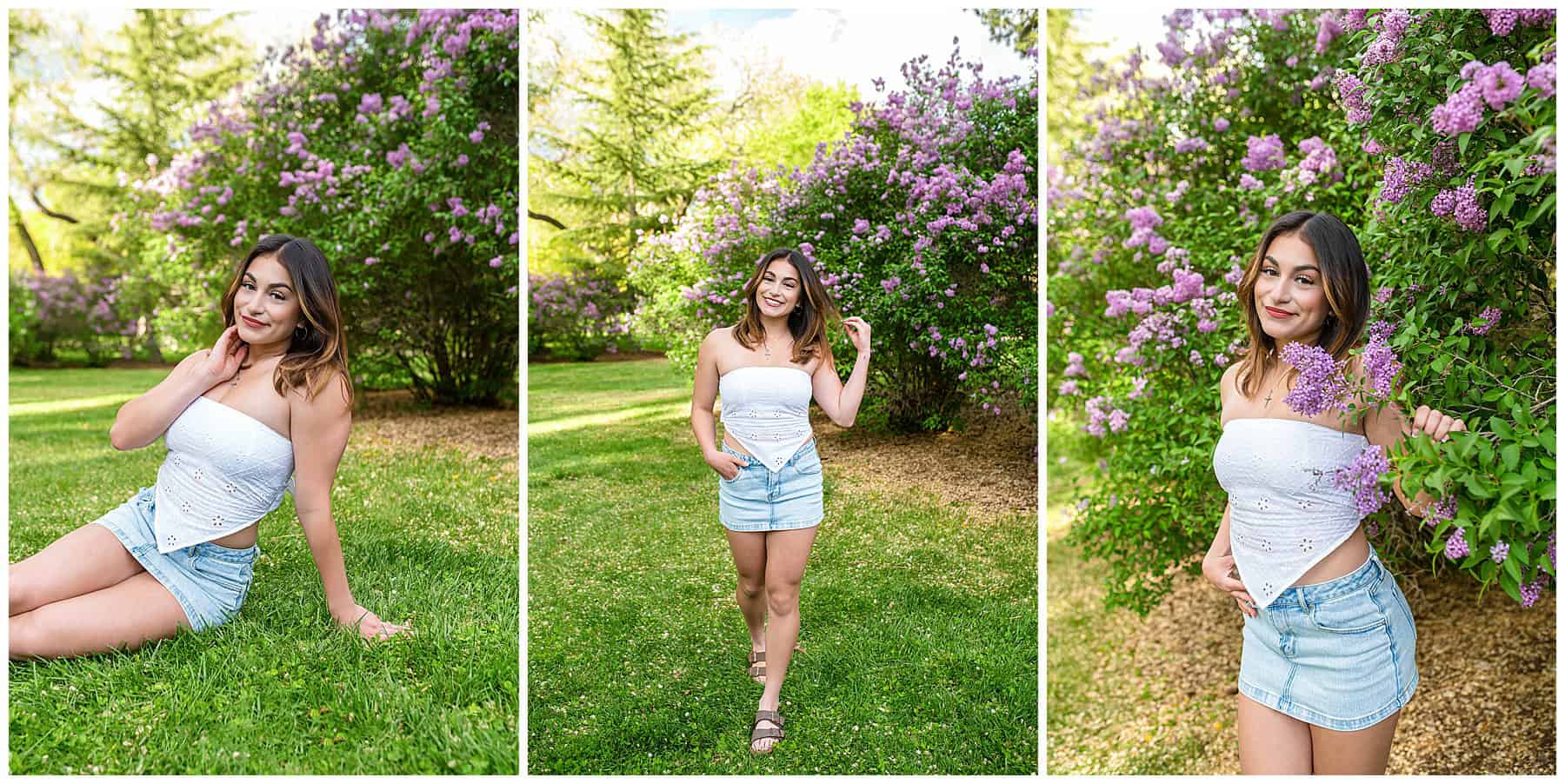 Smiling senior girl posing in front of lilac bushes wearing a jean skirt and white top for spring senior portraits in Albuquerque.