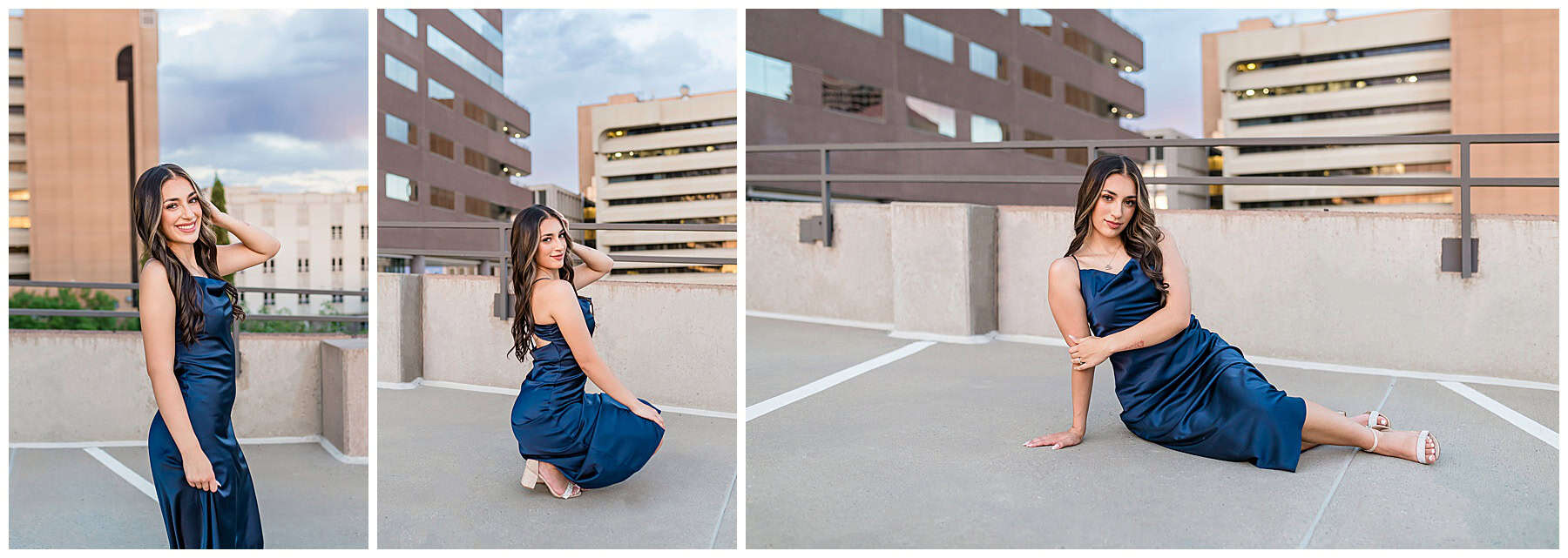 High school senior portraits in downtown Albuquerque taken on a parking garage with city views and a navy blue silk dress